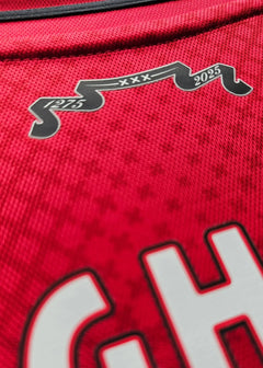 Detail view of red jersey showing 1275 and 2025 in black on the upper back.