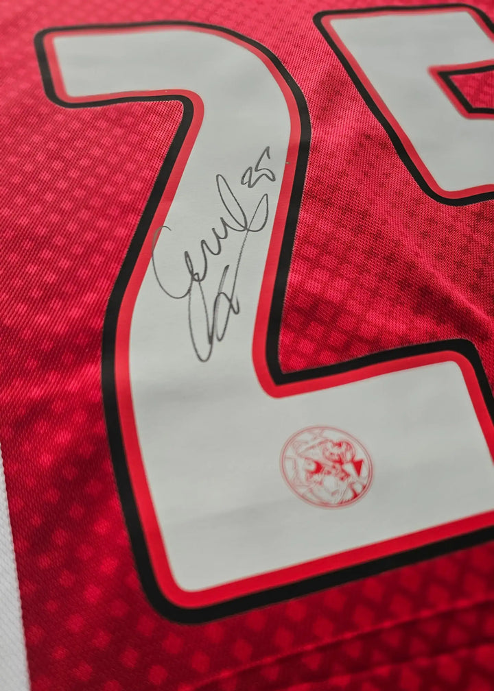 Number 25 signed by Wout Weghorst on a red Ajax football shirt with club crest.