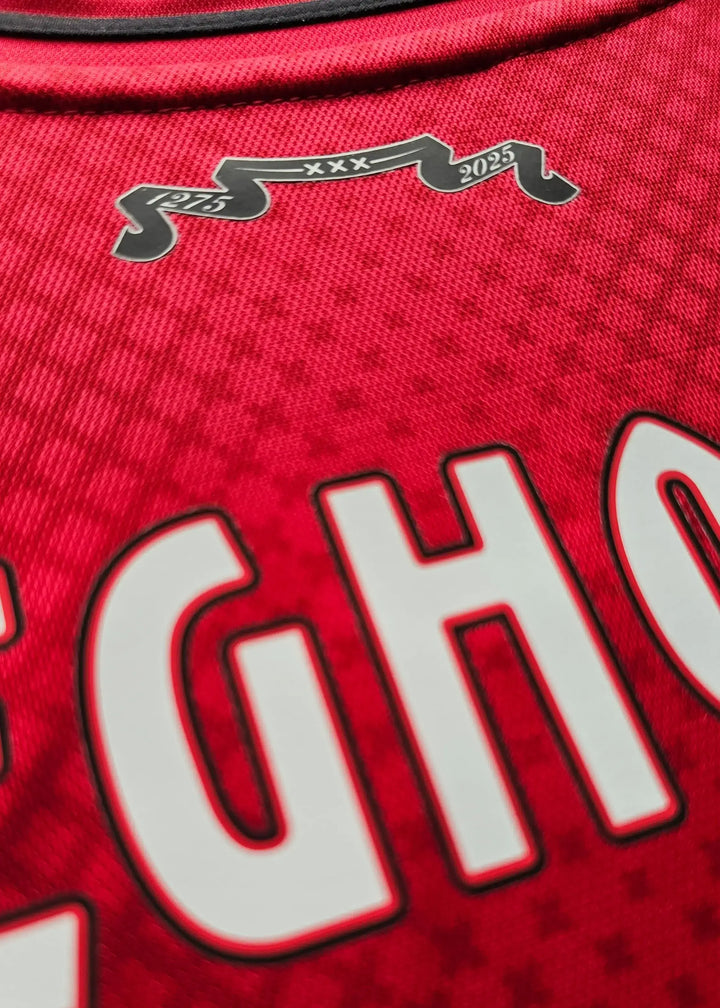 AFC Ajax shirt in red featuring Weghorst name, No. 25, and decorative year details 1975 and 2025.