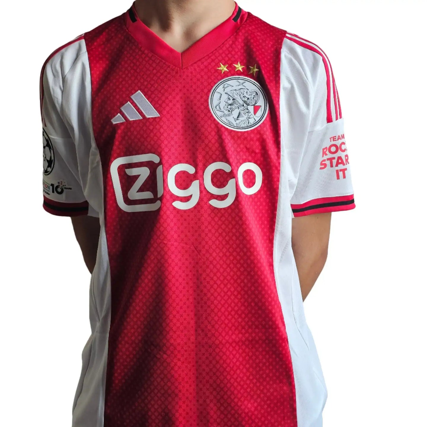 Back view of a signed Wout Weghorst Ajax jersey featuring three stars, Ziggo logo, and Champions League patch.