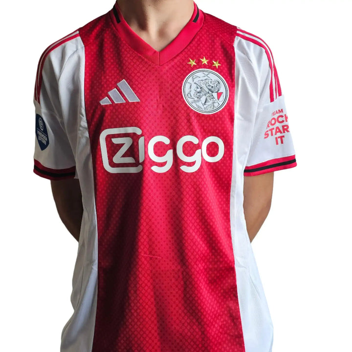 Ajax signed shirt featuring red and white colors, Ziggo sponsor, and three stars above the crest.