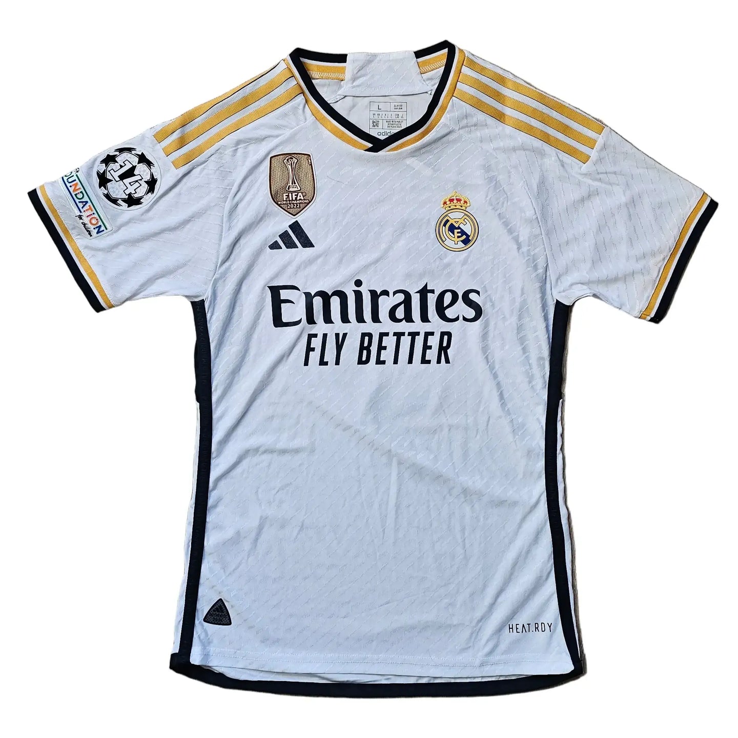 Real Madrid CF home football shirt with Jude Bellingham's signature and No. 5 displayed.