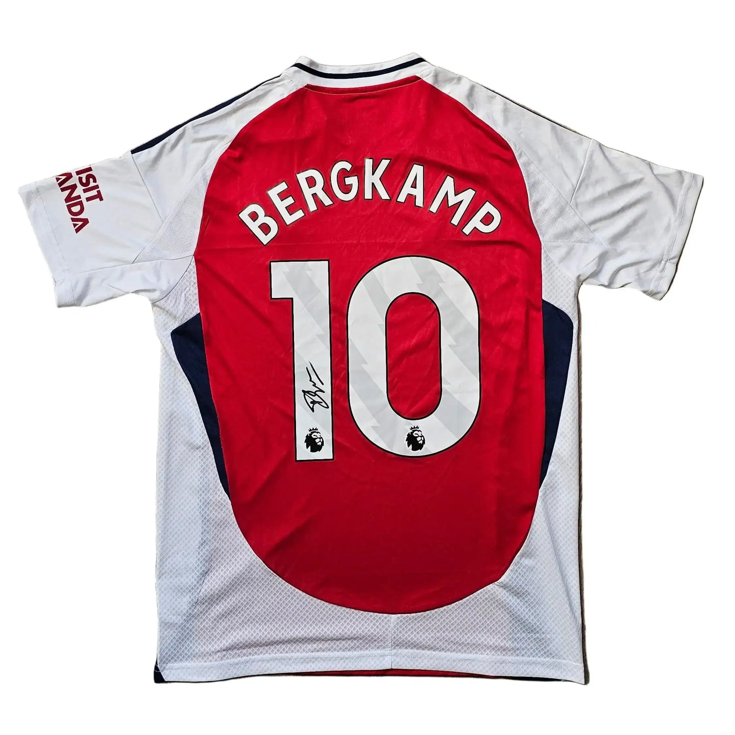 Back view of Arsenal shirt featuring 'BERGKAMP', '10', and a signature on the lower side.