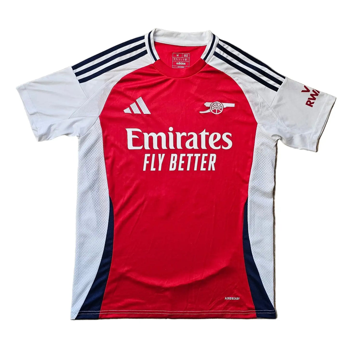 Arsenal 2024-2025 football shirt in red and white, featuring 'Emirates FLY BETTER' on the front.