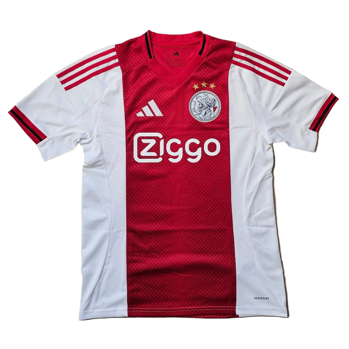 Red and white Ajax shirt featuring Ziggo logo, club crest with three stars, and No. 48.
