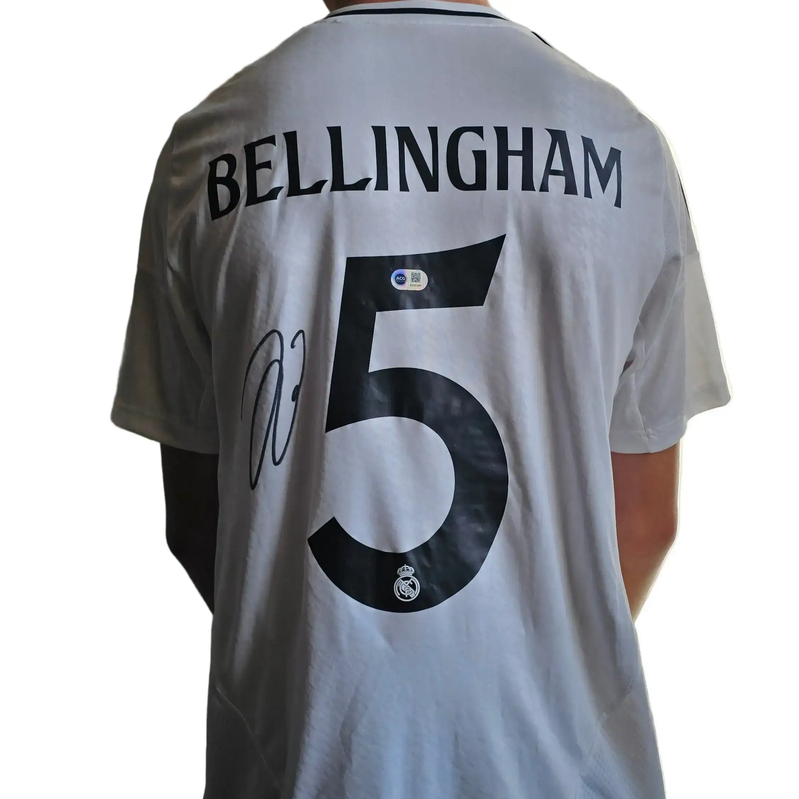 Back view of signed Jude Bellingham No. 5 Real Madrid football shirt with signature.