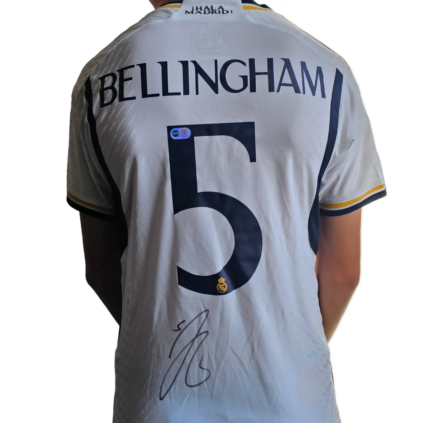 Real Madrid shirt displaying BELLINGHAM, No. 5, and a prominent signature.
