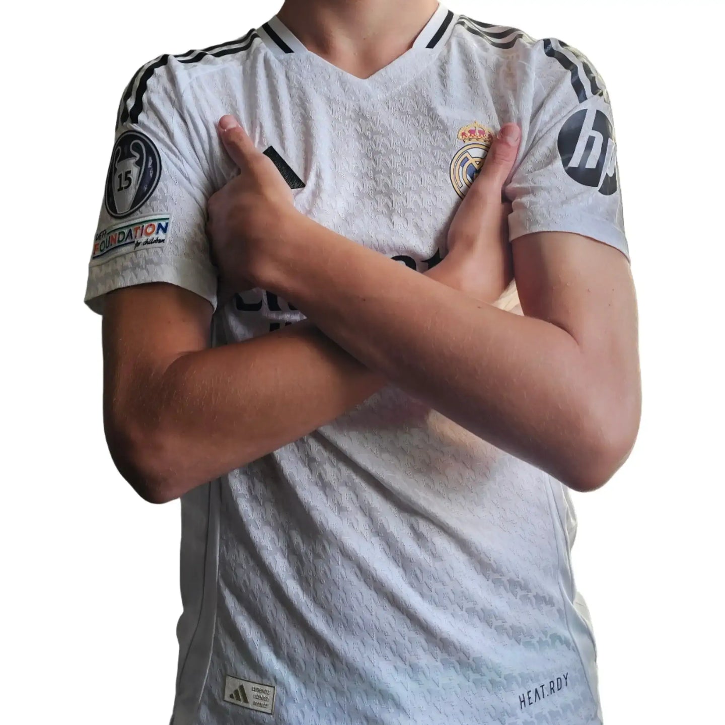 Back view of a signed Kylian Mbappé 9 Real Madrid shirt with crest and sponsor logos visible.