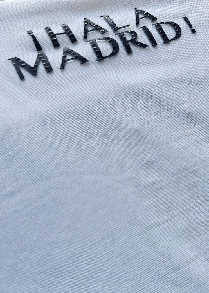 Detail highlighting the embroidered text &