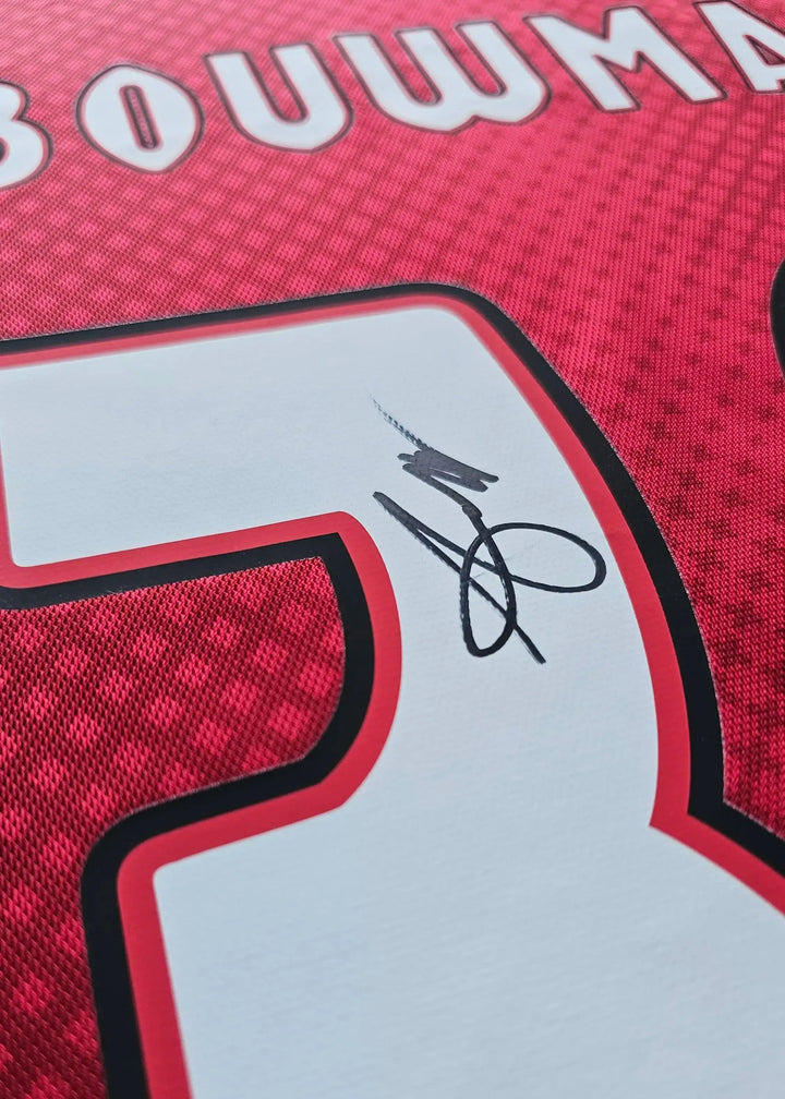 Close-up of the number 30 on a red Ajax shirt with Bouwman's signature below.