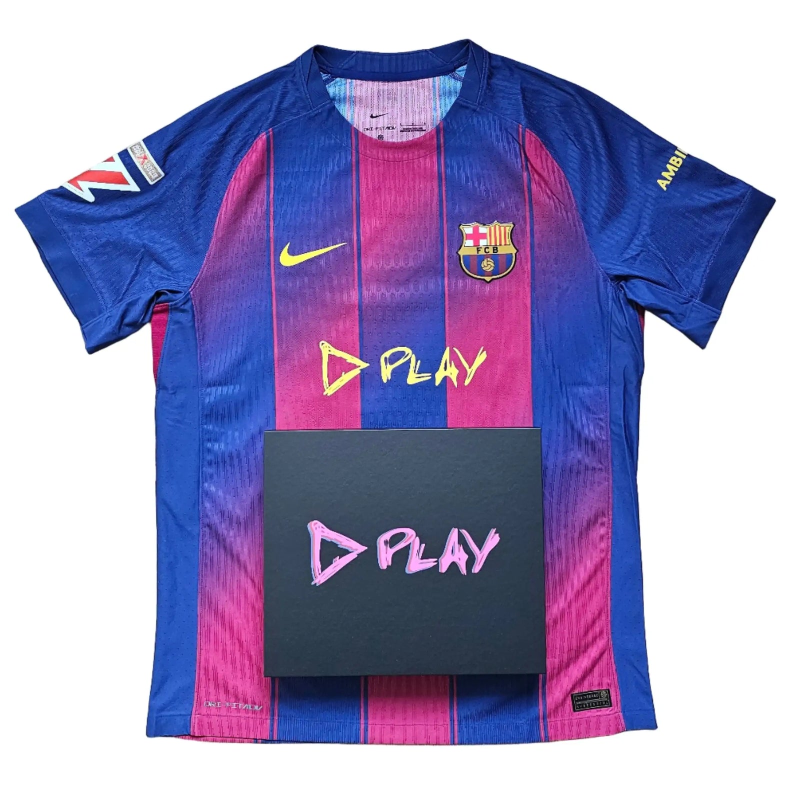 Front view of Barcelona football shirt featuring vibrant blue and red stripes with 'D PLAY' design.