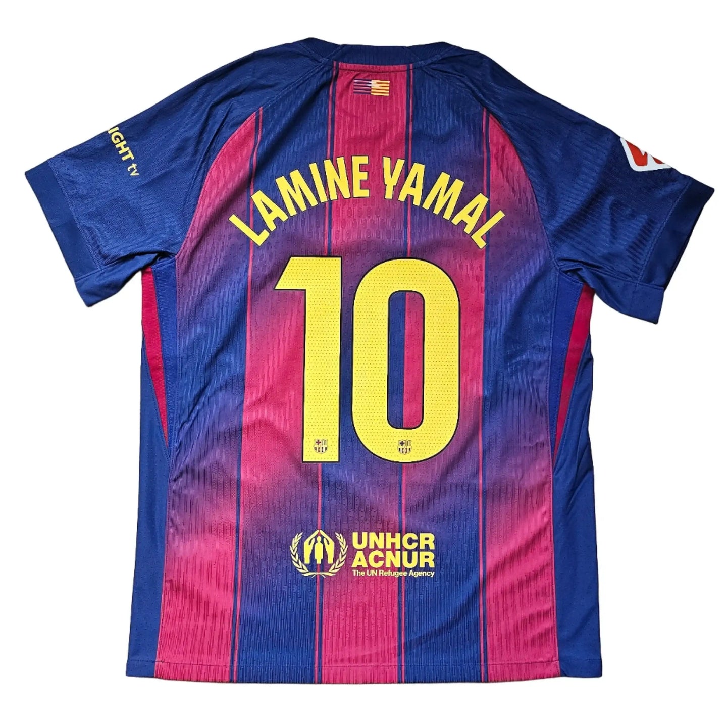 Back view showing Lamine Yamal, No. 10, and UNHCR ACNUR branding in blue and red.