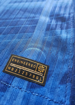 Close-up showing the engineered label with text 'MB 212578GL' on blue fabric.