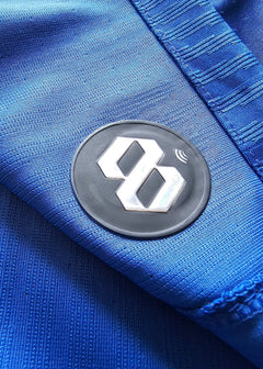 Detail view showing the black and silver 88 logo on the blue football shirt.