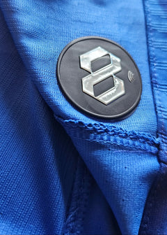 Close-up of the blue fabric showing the 8 logo detail on the sleeve of the Chelsea shirt.