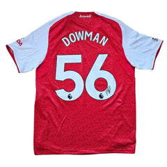 Back view showing Dowman name, No. 56, and signature on a red and white Arsenal football shirt.