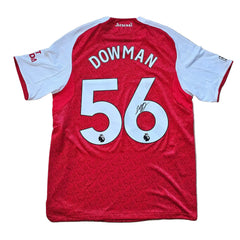 Back view showing No. 56 and the signature of Dowman on a red and white football shirt.