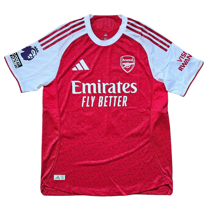 Front view showing Emirates branding, Arsenal crest, and player number 56 on a red football shirt.