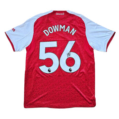 Back view featuring Dowman's signature, No. 56, on a red football shirt with white sleeves.