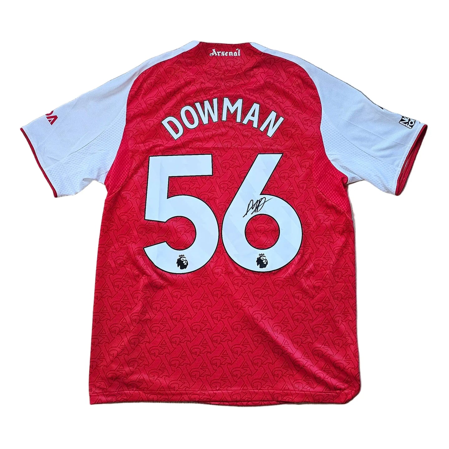 Back view showing the name DOWMAN and No. 56, with a visible signature.