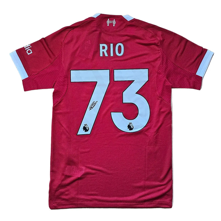 Back view showcasing name 'RIO', No. 73, and signature on a red football shirt.