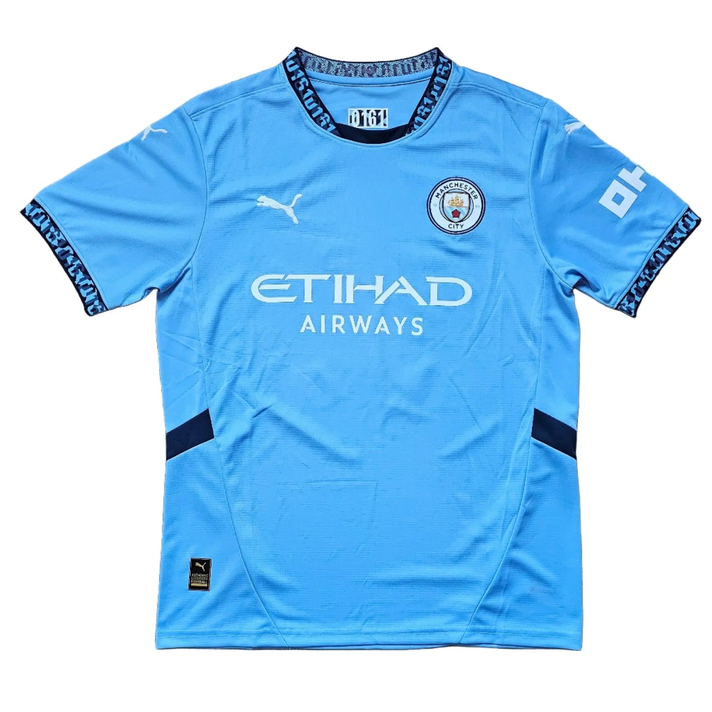Back view showing No. 30, Manchester City crest, and signature.