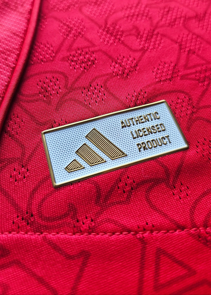 Crest detail showing adidas label with &