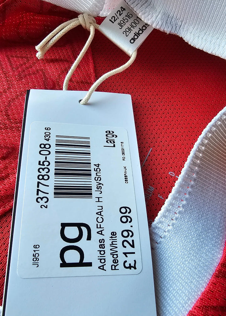 Size Large tag showing Adidas brand, red and white colors, and price of £129.99.