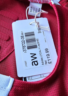 Red football shirt showing Adidas tag with model code and size Small.