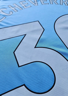 Close-up showing the name Echeverri and No. 30 on the light blue football shirt.