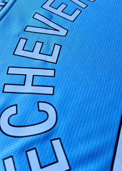 Close-up showing the name Echeverri and the number 30 on a blue football shirt.