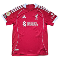 Back view showing Liverpool crest, adidas logo, and standard chartered sponsor.