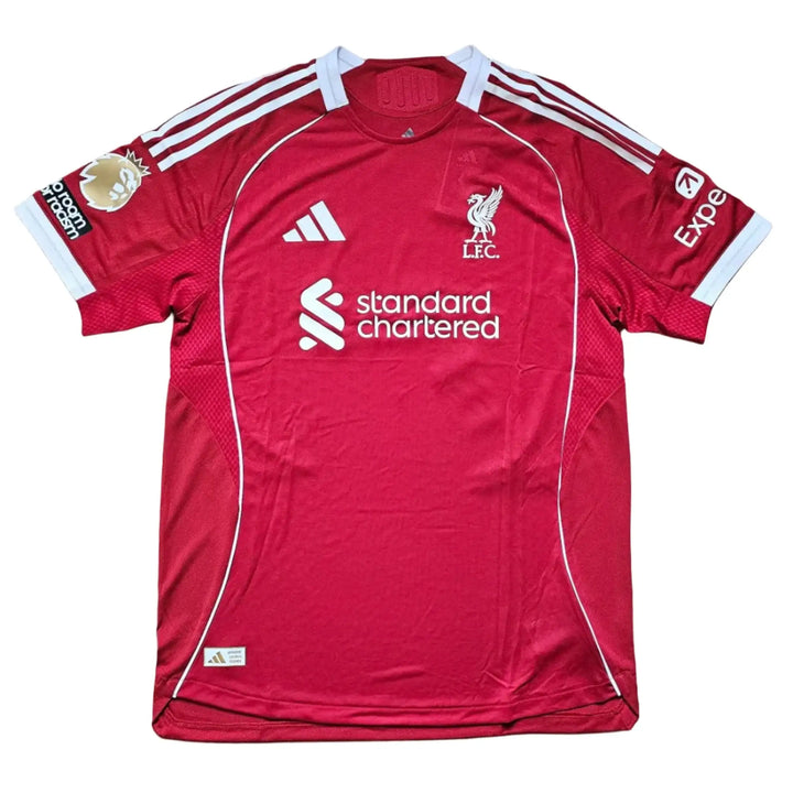 Back view showcasing the adidas logo, Liverpool F.C. crest, and standard chartered sponsor.