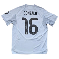 Back view showing Gonzalo and No. 16, with Real Madrid CF crest and signature detail.
