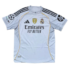 Back view showing Real Madrid crest, gold Adidas logo, and 'Emirates Fly Better' text.