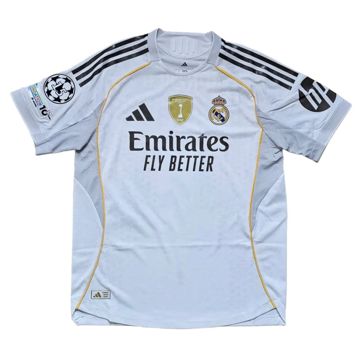 Back view showing Real Madrid crest, gold adidas logo, and 'Emirates Fly Better' text.