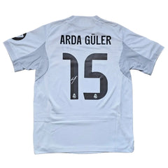 Back view showing Arda Güler, No. 15, and the Real Madrid crest.