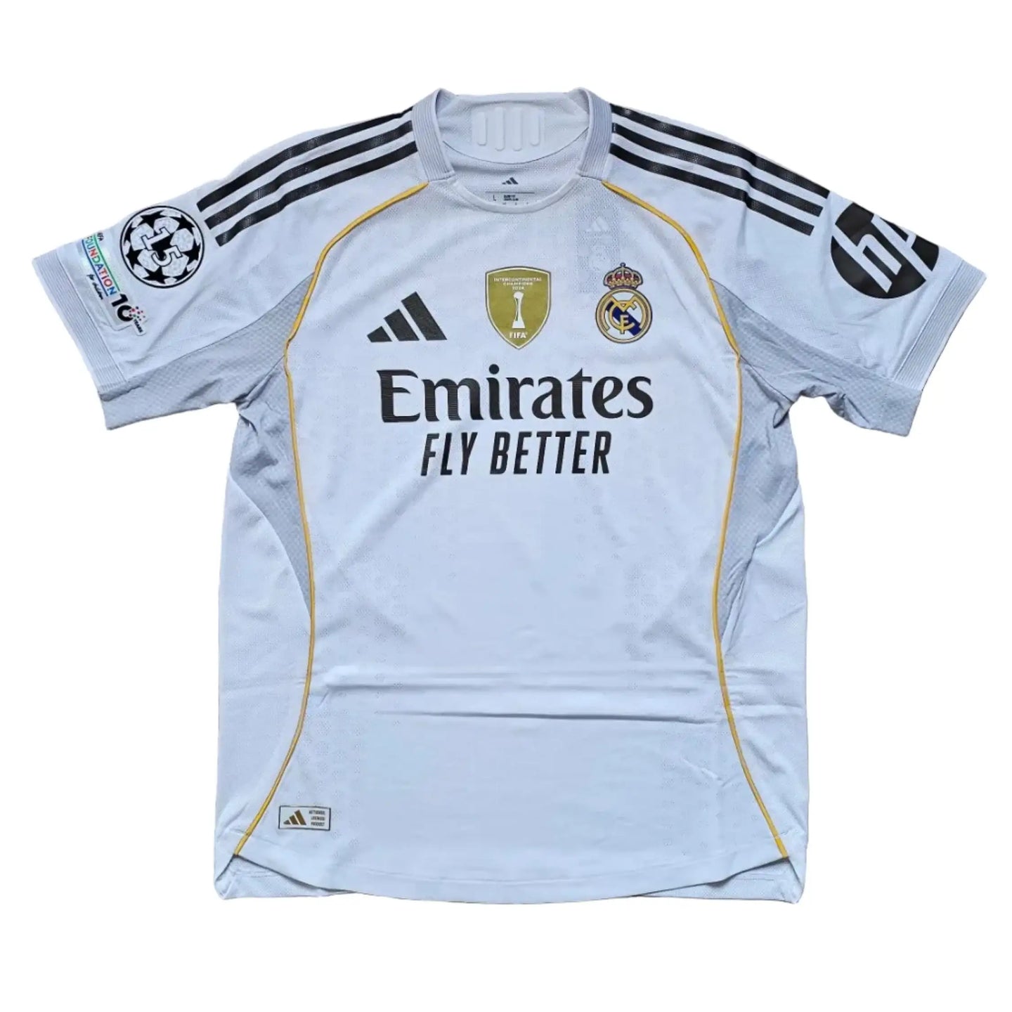 Back view featuring Real Madrid crest, Emirates sponsor, and three stars on sleeves.