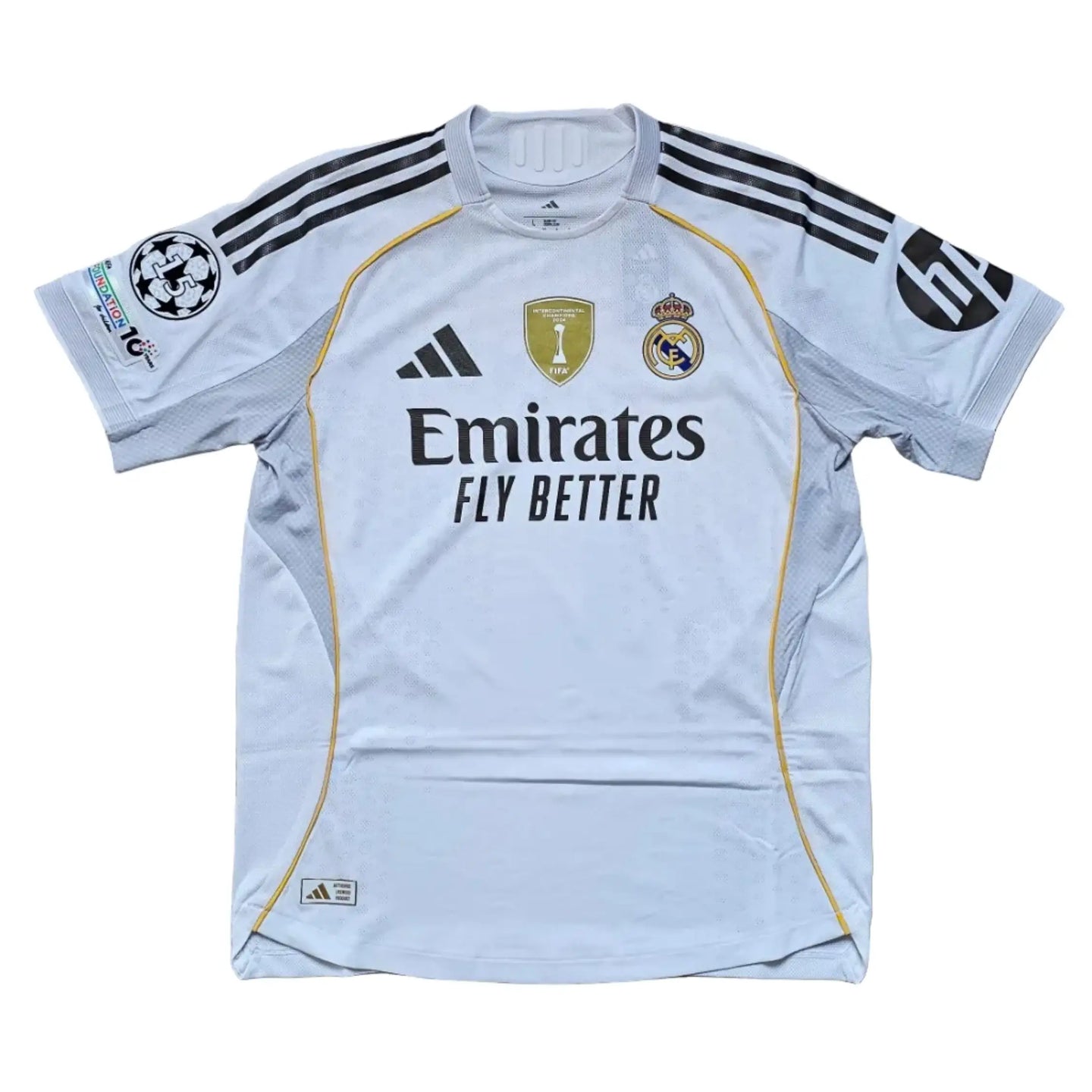 Back view showing Real Madrid crest, adidas branding, and 'Emirates FLY BETTER' text.