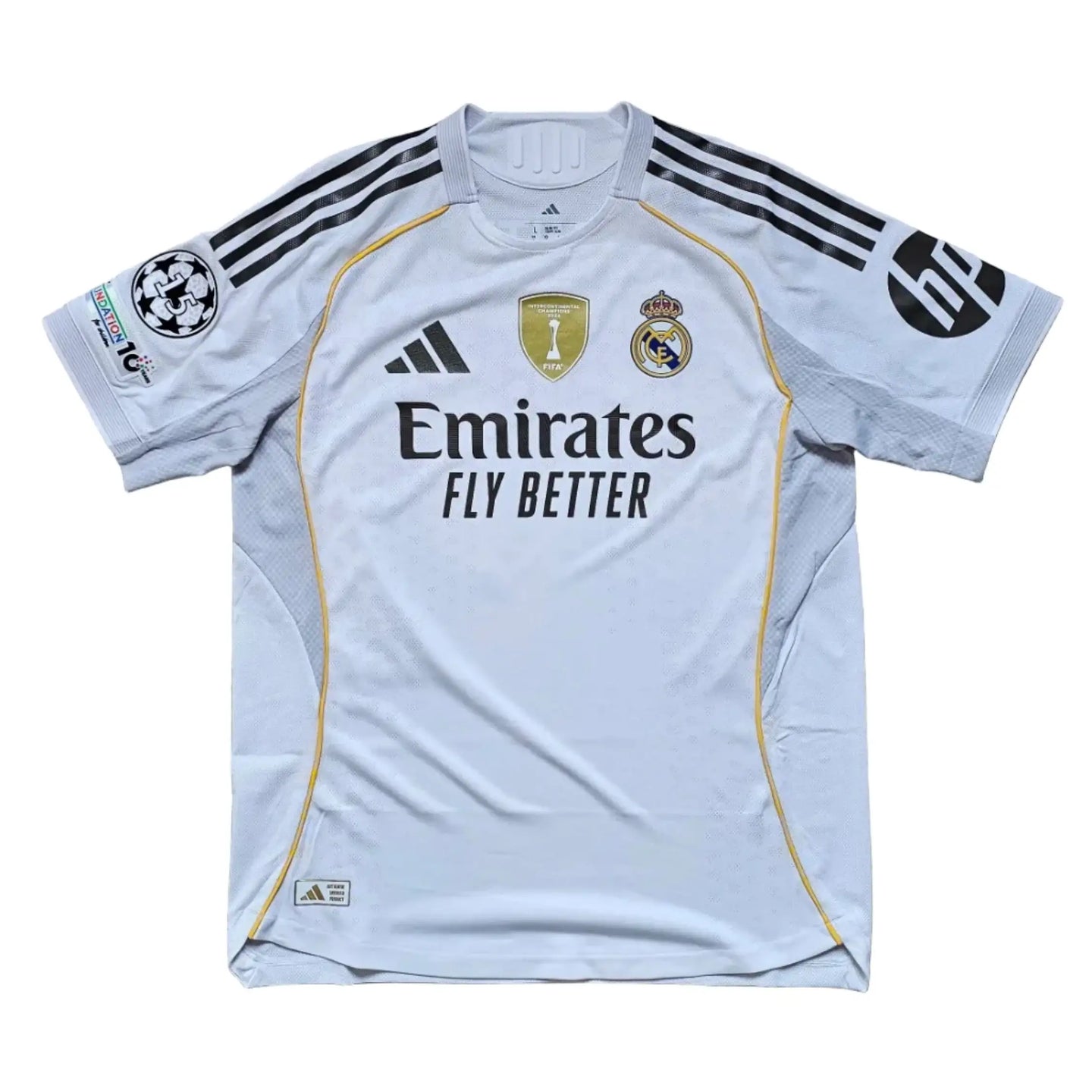 Back view featuring Real Madrid crest, adidas logo, and Emirates sponsor details.