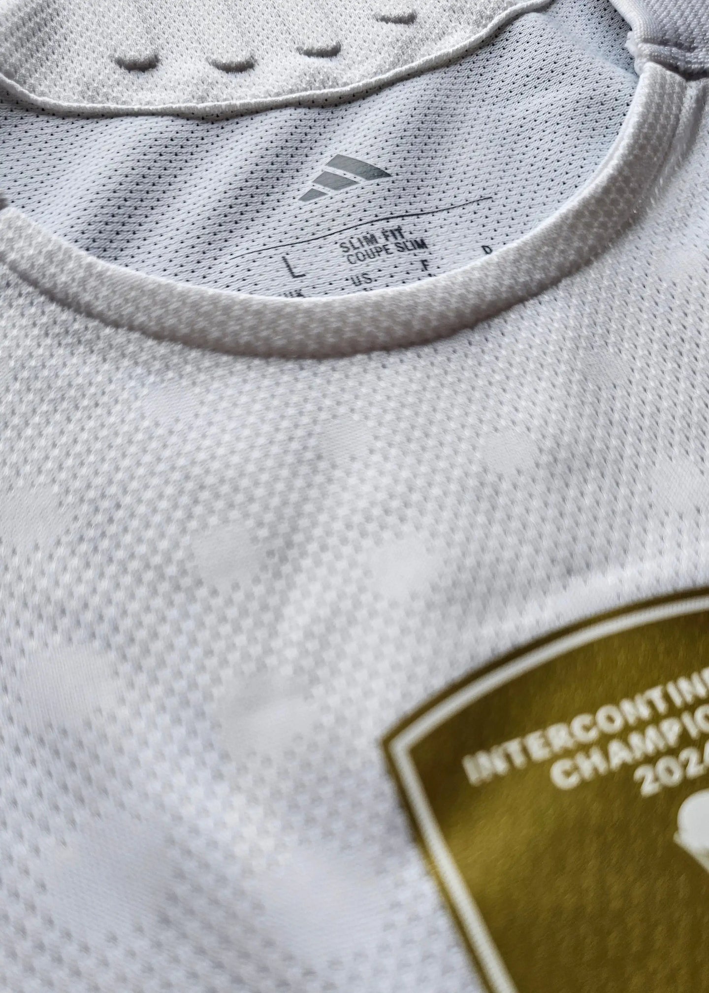 Close-up view showing the collar, adidas logo, and Intercontinental Championship badge.