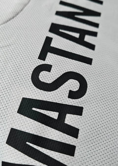 Close-up view of the name 'MASTANTUONO' in black on a signed football shirt.