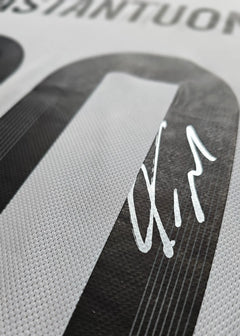 Close-up showing No. 10 and Franco Mastantuono's signature on the football shirt.