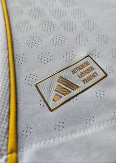 Close-up of the adidas logo with 'AUTHENTIC LICENSED PRODUCT' text on a white background.