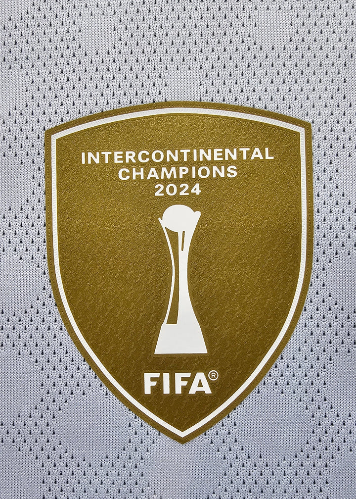 Crest detail displaying Intercontinental Champions 2024 trophy and FIFA logo in gold.