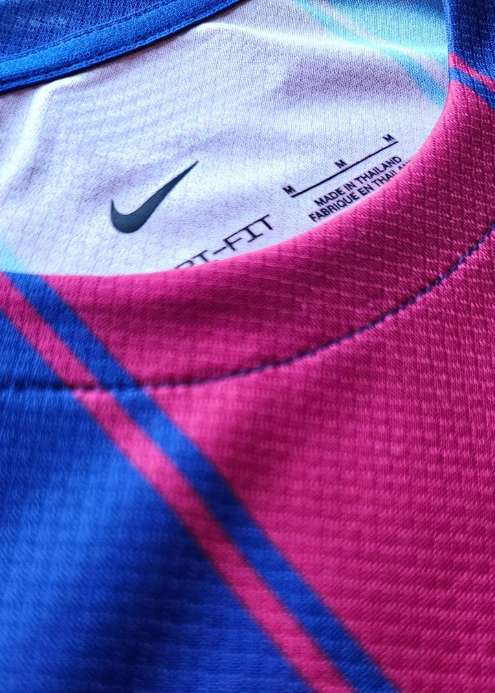 Close-up showing the Nike logo and care label inside the shirt&
