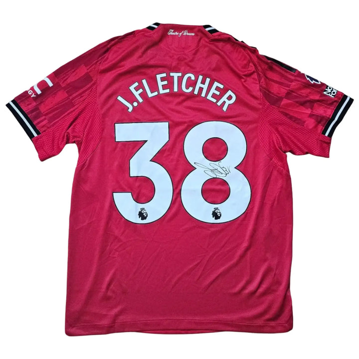Back view displaying J. Fletcher, No. 38, with a visible signature on a red football shirt.