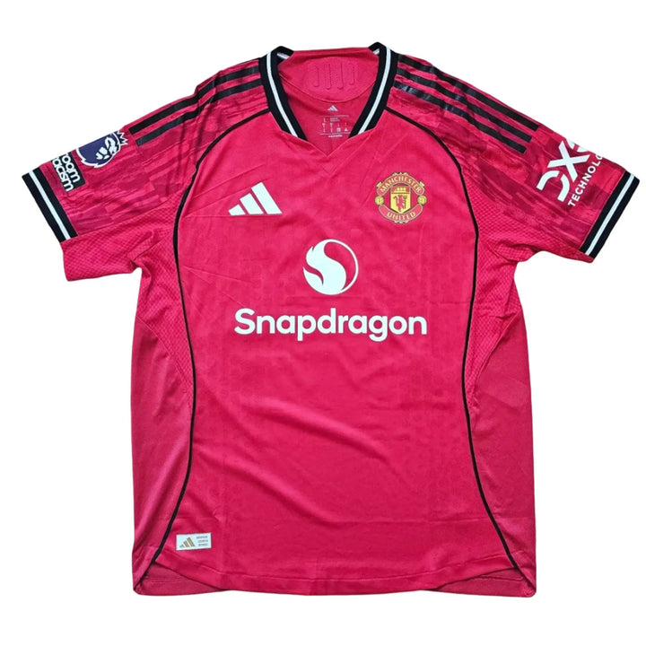 Back view featuring the Manchester United crest, Snapdragon logo, and black stripes.