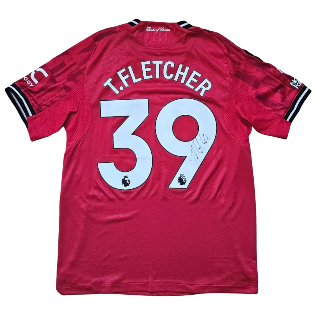 Back view featuring T. Fletcher, No. 39, and a signature on a red football shirt.