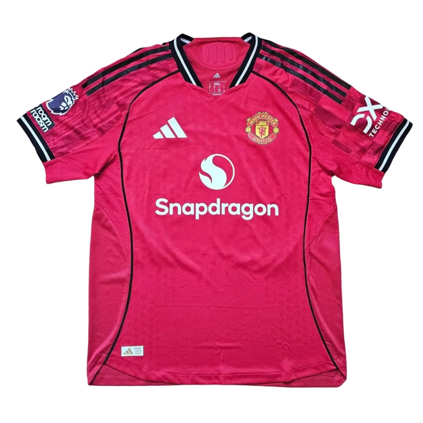 Front view showing Manchester United crest, No. 39, and Snapdragon sponsor on a pink football shirt.